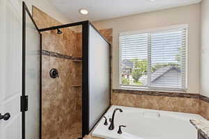 Full bathroom with a bath and a shower stall