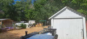 View of yard with a storage shed