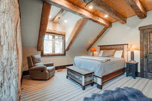 Bedroom with wood ceiling and wood finished floors