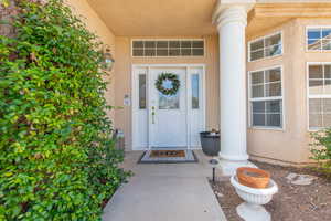 Doorway to property with stucco siding