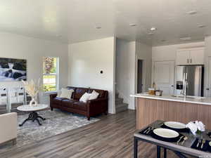 Open-concept kitchen flows from dining to living to kitchen