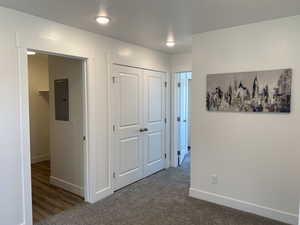 Hall featuring a peek into the laundry