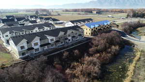 Aerial perspective of suburban area featuring a mountain backdrop