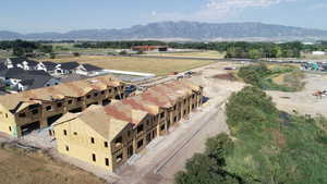 Aerial view of sparsely populated area featuring a mountain backdrop