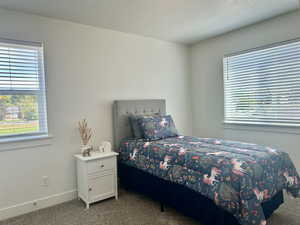 Bedroom with carpet and baseboards