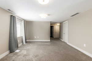 Spare room with carpet flooring and baseboards