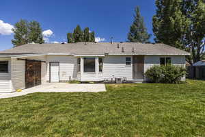 Rear view of property with a patio