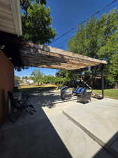 View of patio with a pergola and outdoor lounge area