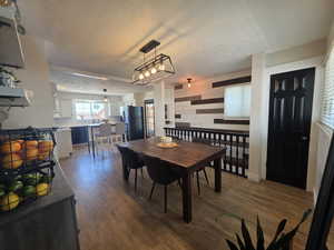 Dining space featuring wood finished floors