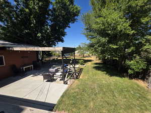 View of yard with a patio area