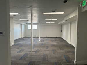 Below grade area featuring carpet flooring and baseboards