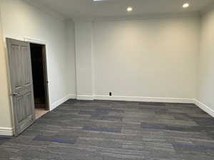 Spare room with carpet floors, crown molding, and recessed lighting