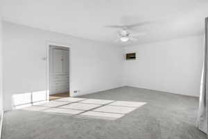 Unfurnished bedroom featuring light colored carpet and a ceiling fan
