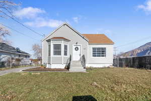 Bungalow-style home featuring a shingled roof