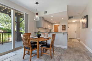 Dining space featuring light wood-style flooring and recessed lighting