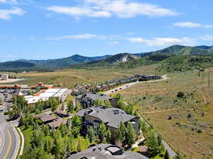 Aerial perspective of suburban area with a mountainous background
