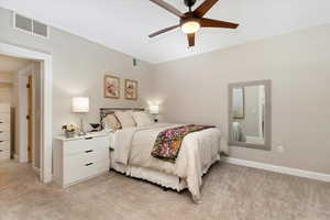 Bedroom featuring light carpet and ceiling fan