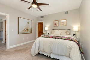 Bedroom with carpet and ceiling fan