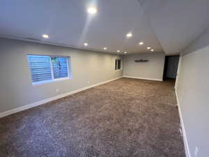 Unfurnished room with recessed lighting and carpet