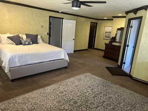 Bedroom featuring carpet floors, a textured ceiling, crown molding, ceiling fan, and recessed lighting