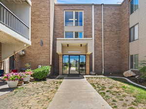 Doorway to property with brick siding