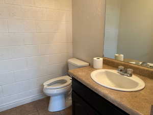 Bathroom featuring vanity and tile patterned flooring