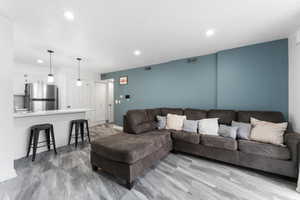 Living area featuring recessed lighting and baseboards