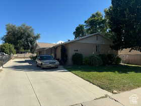 Single story home featuring driveway