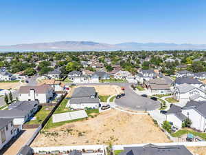 Aerial perspective of suburban area featuring a mountainous background