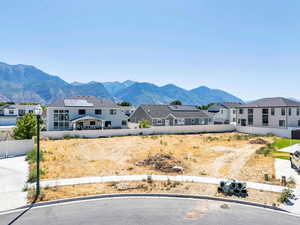 View of mountain backdrop with nearby suburban area
