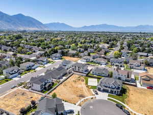 Aerial view of residential area featuring a mountainous background