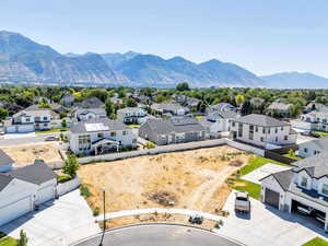 Aerial perspective of suburban area featuring a mountain backdrop