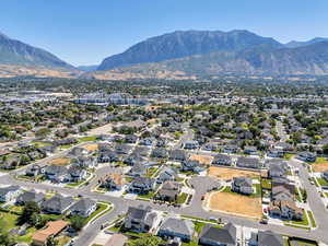 View of property location with a mountain backdrop and nearby suburban area