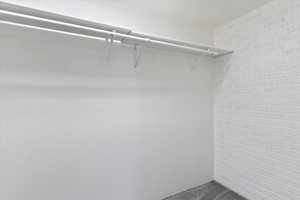 Spacious closet with carpet floors
