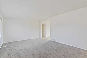 Spare room with carpet flooring and baseboards