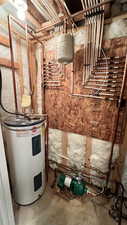 Utilities featuring water heater and manifold