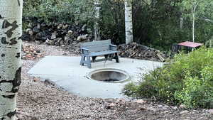 View of yard featuring fire pit area