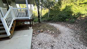 View of yard featuring covered porch