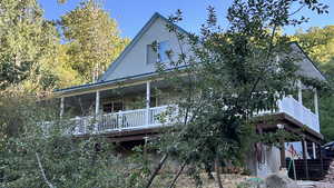 View of front of property featuring the large covered deck