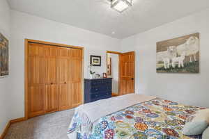Bedroom with carpet floors and a closet