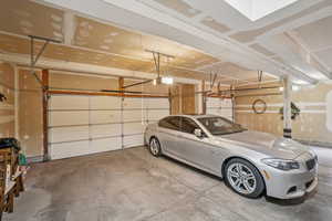 Garage featuring a garage door opener