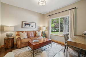 Living room with wood finished floors and baseboards