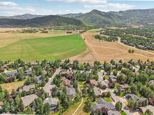 Aerial view of residential area featuring a mountainous background