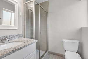 Bathroom with vanity and a stall shower
