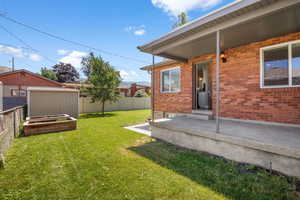 View of yard with a patio area
