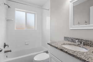 Bathroom with vanity and  shower combination