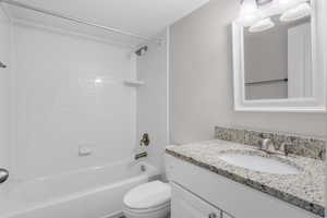 Full bathroom featuring vanity and  shower combination