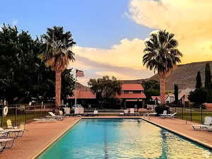 Heated community pool with a patio