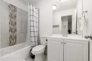 Full bathroom with vanity and shower / tub combo
