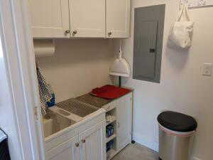 Upstairs kitchen sink, cabinets and countertop